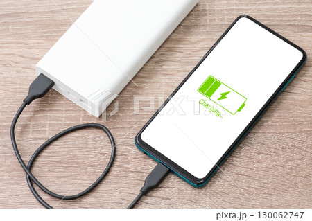 Charging phone with power bank. Using powerbank for charging smartphone 130062747
