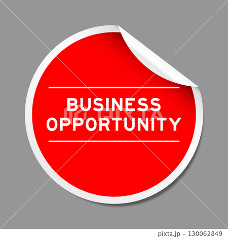 Red color peel sticker label with word business opportunity on gray background 130062849