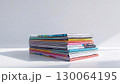 積まれた雑誌。白背景。 130064195