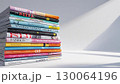 積まれた雑誌。白背景。 130064196