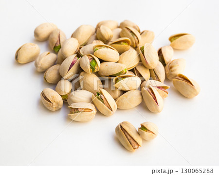 roasted pistachios on white background roasted pistachios on white background 130065288