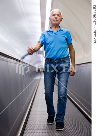 European old man going down to subway 130065292