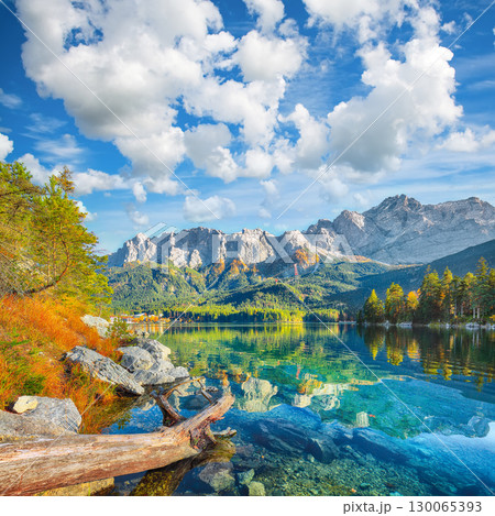 Amazing autumn landscape of Eibsee Lake in front of Zugspitze summit under sunlight. 130065393