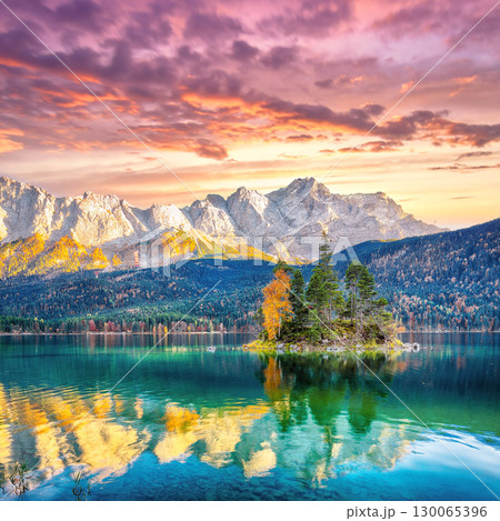 Stunning autumn landscape of Eibsee Lake in front of Zugspitze summit under sunset 130065396