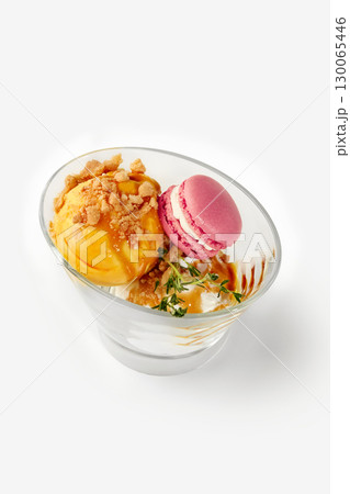 Delicious ice cream dessert with macarons and crumble topping Delicious ice cream dessert with macarons and crumble topping 130065446