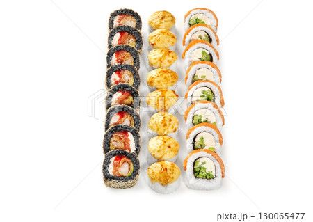 Sushi rolls forming vertical lines on white background 130065477
