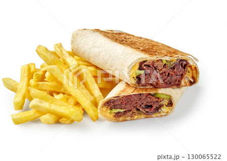 Delicious shawarma and french fries presenting a tasty culinary combination 130065522