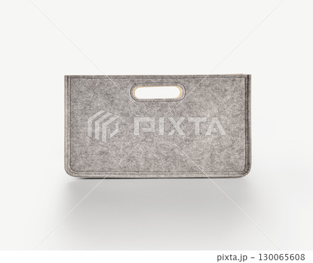 Gray felt storage box with handle on white background 130065608