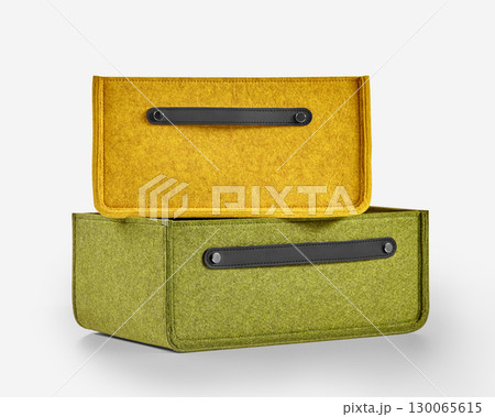 Two stylish felt storage boxes with leather handles creating modern organization Two stylish felt storage boxes with leather handles creating modern organization 130065615