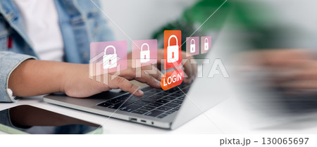 Cybersecurity login with padlock icons and secure access on laptop computer Cybersecurity login with padlock icons and secure access on laptop computer 130065697