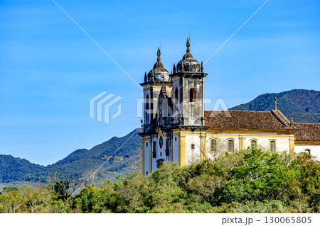 Church tower amidst the vegetation Church tower amidst the vegetation 130065805