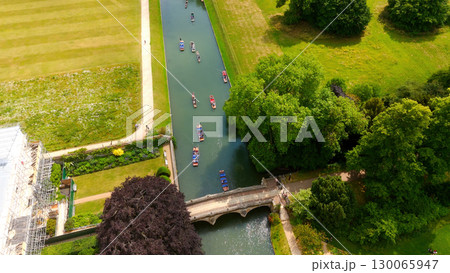 Punting on the River Cam in Cambridge, aerial view of a summer day Punting on the River Cam in Cambridge, aerial view of a summer day 130065947