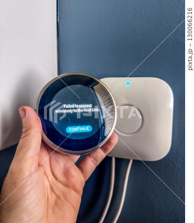 Modern smart thermostat device showing a failed wireless connection to the heat link. High quality photo 130066216