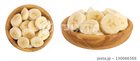 peeled banana pieces in wooden bowl isolated on white background. Top view. Flat lay. peeled banana pieces in wooden bowl isolated on white background. Top view. Flat lay. 130066568