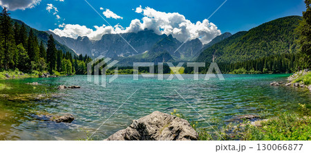 Fusine Lakes pristine turquoise waters surrounded by dramatic Alpine peaks in Friuli Venezia Fusine Lakes pristine turquoise waters surrounded by dramatic Alpine peaks in Friuli Venezia 130066877
