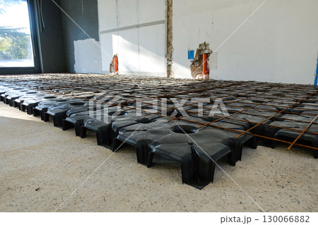 Reinforced Concrete Foundation System with Steel Rebar Grid During Active Building Construction 130066882
