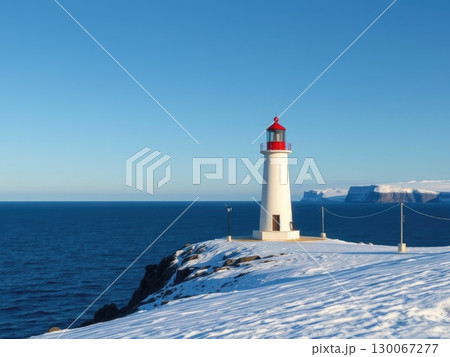 Snowy Coastal Lighthouse on a Winter Day 130067277