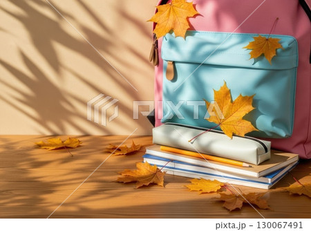 Fresh Start: New Backpack with School Supplies and Autumn Leaves Fresh Start: New Backpack with School Supplies and Autumn Leaves 130067491