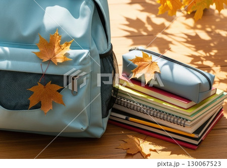 Fresh Start: New Backpack with School Supplies and Autumn Leaves Fresh Start: New Backpack with School Supplies and Autumn Leaves 130067523