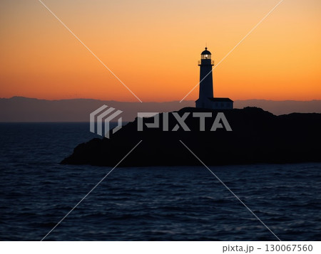 Powerful Lighthouse Beam at Golden Sunset or Sunrise 130067560