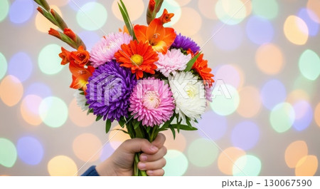 First Day of School Tradition - Hand Holding Seasonal Flowers 130067590