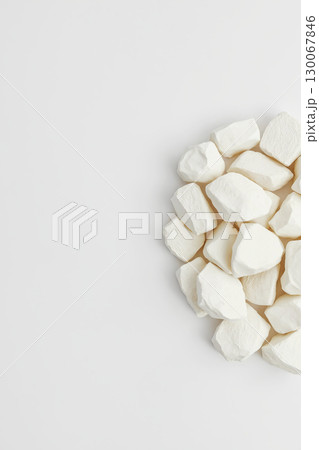 white chalk-like stones. Abstract minimalistic background white chalk-like stones. Abstract minimalistic background 130067846
