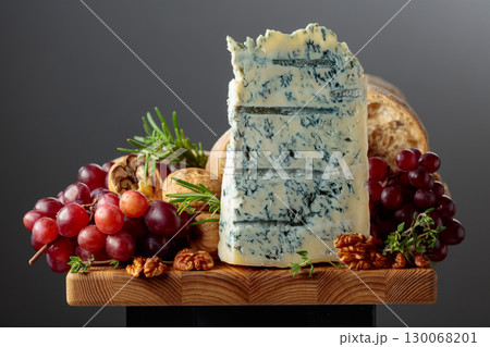 Gorgonzola cheese with ciabatta, walnuts, grapes, and aromatic herbs. Gorgonzola cheese with ciabatta, walnuts, grapes, and aromatic herbs. 130068201
