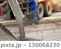 Cement trucks in the construction area are pouring cement. 130068230