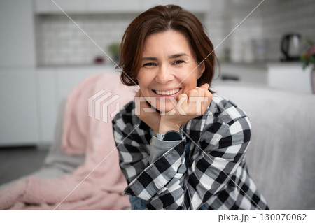 Portrait Of A Happy, Smiling Young Woman At Home 130070062