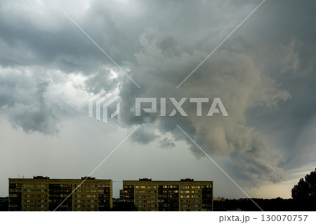 Massive storm clouds rolling over residential buildings before heavy rain and thunderstorm 130070757