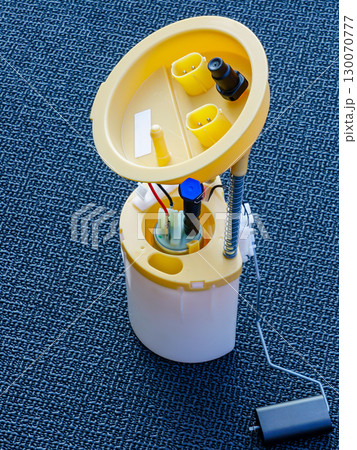 Automotive fuel pump module with float sensor on textured surface, spare part for vehicle repair Automotive fuel pump module with float sensor on textured surface, spare part for vehicle repair 130070777