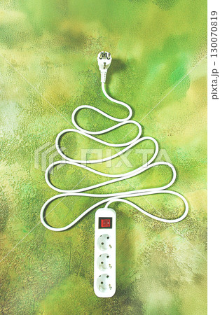 A power strip is arranged in the shape of a Christmas tree, artistically placed on a vibrant green and yellow backdrop. The design adds a playful touch to the festive atmosphere. A power strip is arranged in the shape of a Christmas tree, artistically placed on a vibrant green and yellow backdrop. The design adds a playful touch to the festive atmosphere. 130070819