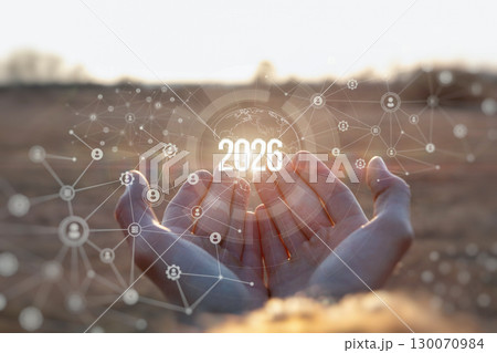 Hopeful hands envisioning the future of technology in 2026. Hopeful hands envisioning the future of technology in 2026. 130070984