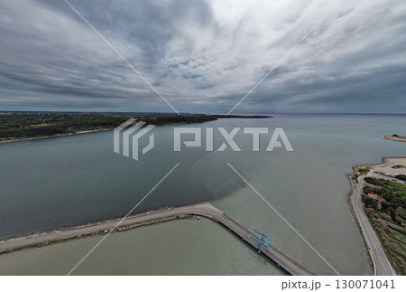 Aerial panorama view of a small drawbridge. Antenal, Istria, Croatia. Aerial panorama view of a small drawbridge. Antenal, Istria, Croatia. 130071041