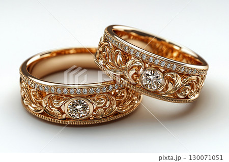 Luxury pair of Wedding Rings on a white background. Rococo Renaissance style. Luxury pair of Wedding Rings on a white background. Rococo Renaissance style. 130071051