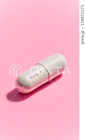 NAD Capsule On Soft Pink Background For Anti-Aging Supplement Visuals, Longevity Wellness Trends, Modern Biohacking Concepts, And Minimal Pharmaceutical Product Design NAD Capsule On Soft Pink Background For Anti-Aging Supplement Visuals, Longevity Wellness Trends, Modern Biohacking Concepts, And Minimal Pharmaceutical Product Design 130071271