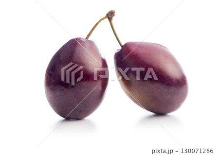 Ripe plums isolated on white background. Ripe plums isolated on white background. 130071286
