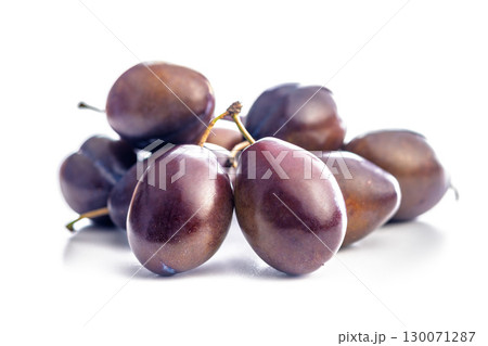 Ripe plums isolated on white background. Ripe plums isolated on white background. 130071287