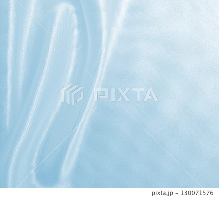 Smooth elegant blue silk or satin luxury cloth texture as abstract background. Luxurious background design Smooth elegant blue silk or satin luxury cloth texture as abstract background. Luxurious background design 130071576
