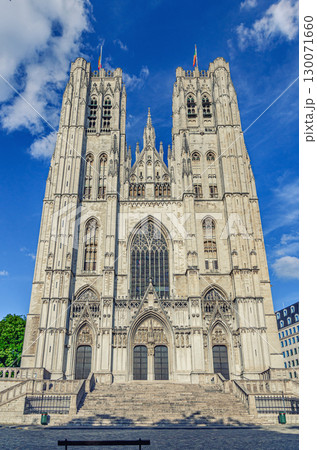 The Cathedral of St. Michael and St. Gudula medieval Roman Catholic cathedral Brabantine Gothic architecture style building with bell towers in Brussels city historical center, vertical view, Belgium The Cathedral of St. Michael and St. Gudula medieval Roman Catholic cathedral Brabantine Gothic architecture style building with bell towers in Brussels city historical center, vertical view, Belgium 130071660