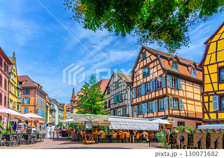 Old houses half-timbered style colorful facade, medieval buildings with multicolored walls, shutters windows and street restaurant in old town Colmar city historic centre, Alsace region, France Old houses half-timbered style colorful facade, medieval buildings with multicolored walls, shutters windows and street restaurant in old town Colmar city historic centre, Alsace region, France 130071682