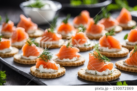 Delicious smoked salmon canapes are full of flavor and easy to make, serving as a perfect appetizer for any occasion. AI Generated 130072869
