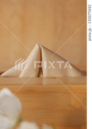 closeup of natural tissue paper in a box  130075692