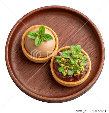 Delicate Foie Gras Mousse Canapes on Crisp Brioche Base with Fig Gel and Crushed Pistachios Garnish 130077861