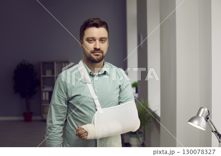 Young man with broken arm wearing arm splint Young man with broken arm wearing arm splint 130078327