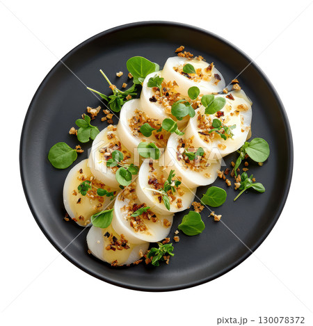 Delicate Amberjack Sashimi Artfully Arranged in Spiral with Yuzu Truffle Dressing and Topped with Micro Leaves 130078372
