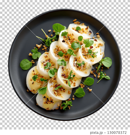 Delicate Amberjack Sashimi Artfully Arranged in Spiral with Yuzu Truffle Dressing and Topped with Micro Leaves 130078372
