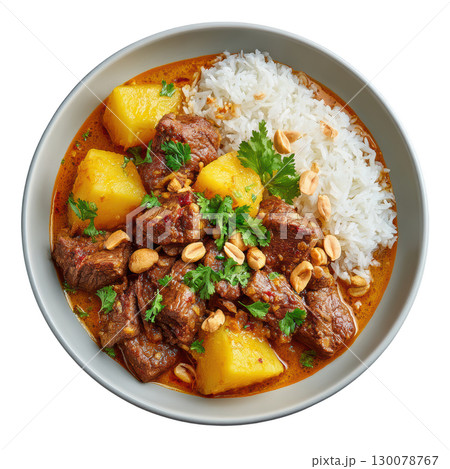 Rich Beef Massaman Curry with Potatoes, Peanuts, and Rice in a Bowl for a Flavorful Culinary Experience Rich Beef Massaman Curry with Potatoes, Peanuts, and Rice in a Bowl for a Flavorful Culinary Experience 130078767