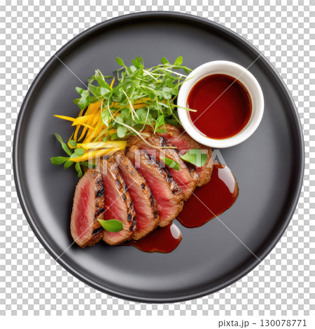 Delicate Seared Wagyu Beef Tataki with Ponzu Sauce and Fresh Garnishes on Elegant Black Plate 130078771