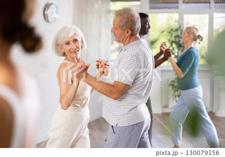 Group of multiethnic mature people dancing social dance 130079156